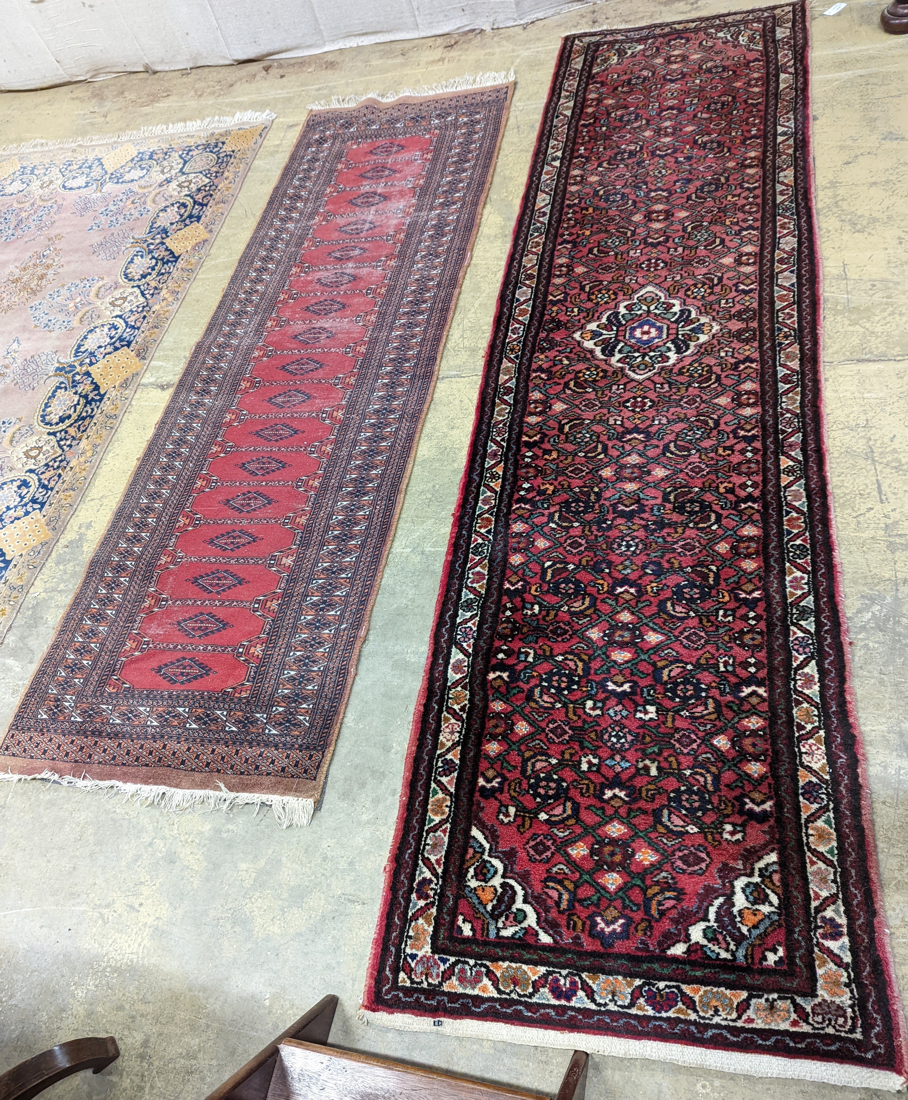 A North West Persian red ground runner and a Bokhara runner, larger approx. 290 x 78cm